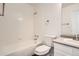 Clean bathroom with a shower/tub combo, white tile, and vanity at 137 S Bedford Ave, Castle Rock, CO 80104