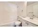 Clean bathroom with shower/tub, vanity, and white tile at 137 S Bedford Ave, Castle Rock, CO 80104