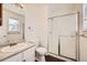 Bathroom with a shower stall, toilet, and vanity with sink at 137 S Bedford Ave, Castle Rock, CO 80104