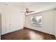 Bright bedroom with ceiling fan, wood floors, and window at 137 S Bedford Ave, Castle Rock, CO 80104