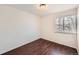 Spacious bedroom with dark wood floors and a window with blinds at 137 S Bedford Ave, Castle Rock, CO 80104