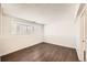 Well-lit bedroom with dark wood floors and a bay window at 137 S Bedford Ave, Castle Rock, CO 80104