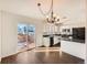 Dining area with hardwood floors and a view of the kitchen and deck at 137 S Bedford Ave, Castle Rock, CO 80104