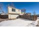 View of the attached garage and backyard, showing a snow-covered ground at 137 S Bedford Ave, Castle Rock, CO 80104