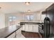 Modern kitchen with stainless steel appliances and an eat-in area at 137 S Bedford Ave, Castle Rock, CO 80104