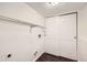 Basement laundry room with wire shelving, a washer/dryer hookup, and white panel doors at 137 S Bedford Ave, Castle Rock, CO 80104