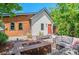 Backyard with outdoor lounge area, fire pit, wood fence, and stylish landscaping at 3425 W Moncrieff Pl, Denver, CO 80211