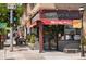 Exterior view of Mondo Vino wine store and restaurant with a red awning at 3425 W Moncrieff Pl, Denver, CO 80211