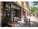 Exterior of Novo Coffee with a Personal sitting at an outdoor table at 3425 W Moncrieff Pl, Denver, CO 80211