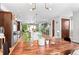 Bright kitchen with stainless steel appliances, a large island, and hardwood floors at 3425 W Moncrieff Pl, Denver, CO 80211