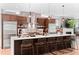Elegant kitchen with a spacious island, stainless steel appliances, and contemporary design at 3425 W Moncrieff Pl, Denver, CO 80211