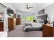 Bright main bedroom with large windows, a ceiling fan, and ample closet space at 3425 W Moncrieff Pl, Denver, CO 80211
