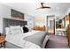 Comfortable main bedroom featuring a ceiling fan, dresser, and a peaceful ambiance at 3425 W Moncrieff Pl, Denver, CO 80211