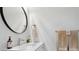 Bright bathroom with a sleek vanity, modern faucet, and decorative towels at 2262 Ammons St, Lakewood, CO 80214