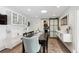 Bright dining room with built-in cabinetry and sliding barn door at 2262 Ammons St, Lakewood, CO 80214