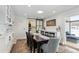 Dining area with built-in cabinetry and access to laundry room at 2262 Ammons St, Lakewood, CO 80214