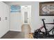 Bright hallway with wood floors and convenient built-in storage cabinets at 2262 Ammons St, Lakewood, CO 80214
