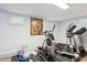 Home gym with exercise equipment and bright lighting from the basement windows at 2262 Ammons St, Lakewood, CO 80214