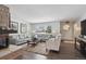 Living room with hardwood floors, fireplace and seating area at 2262 Ammons St, Lakewood, CO 80214