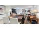 Basement living area featuring a TV, exercise equipment, and a work desk with a hutch at 2262 Ammons St, Lakewood, CO 80214