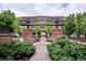Brick arbor covered courtyard providing serene walk ways in the community at 10111 Inverness Main St # 230, Englewood, CO 80112