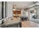 Open living space with a modern kitchen, dining area with a large table, and a cozy living room with a fireplace at 10111 Inverness Main St # 230, Englewood, CO 80112