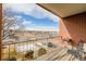 Private balcony overlooking street and distant mountain views at 310 S Ames St # 11, Lakewood, CO 80226