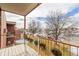 Apartment balcony overlooking a tree-lined street and distant city views at 310 S Ames St # 11, Lakewood, CO 80226