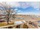 View from apartment balcony showcasing a tree-lined street and distant mountains at 310 S Ames St # 11, Lakewood, CO 80226