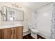 Clean bathroom with a bathtub, shower, and modern vanity at 310 S Ames St # 11, Lakewood, CO 80226