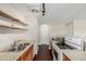 Simple kitchen with wood cabinets, floating shelves, and stainless steel appliances at 310 S Ames St # 11, Lakewood, CO 80226