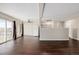 Living room, kitchen, and dining area with dark laminate floors at 310 S Ames St # 11, Lakewood, CO 80226