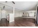 Open concept living room and kitchen with mirrored wall at 310 S Ames St # 11, Lakewood, CO 80226