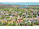 Scenic aerial view of neighborhood with mountain views, lake, baseball fields, and open spaces at 6527 S Yarrow Way, Littleton, CO 80123