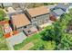 Aerial view of backyard with deck, shed, lawn, mature trees, and privacy fence at 6527 S Yarrow Way, Littleton, CO 80123