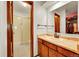 Bathroom featuring a vanity and a glass-enclosed shower at 6527 S Yarrow Way, Littleton, CO 80123