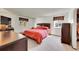 Bright bedroom with dual windows and classic furnishings at 6527 S Yarrow Way, Littleton, CO 80123
