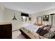 Cozy bedroom with Paris-themed decor and natural light at 6527 S Yarrow Way, Littleton, CO 80123
