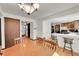 Charming dining area adjoins a kitchen and offers a perfect spot for Gathering meals at 6527 S Yarrow Way, Littleton, CO 80123