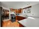 Bright kitchen featuring wood cabinets, stainless steel appliances, and a well-lit work space at 6527 S Yarrow Way, Littleton, CO 80123