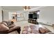 Spacious living room is bathed in natural light and offers a seamless connection to the kitchen at 6527 S Yarrow Way, Littleton, CO 80123