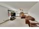Inviting living room with a brick fireplace and a comfortable seating arrangement at 6527 S Yarrow Way, Littleton, CO 80123