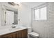 Beautiful bathroom with modern vanity, subway tiles and shower at 201 Greenwood Blvd, Denver, CO 80221