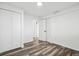 This bedroom offers wood floors and double closet doors at 201 Greenwood Blvd, Denver, CO 80221