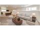 Finished basement with carpet, light walls, sofa, and a pool table at 73 N Dutch Valley Rd, Bennett, CO 80102