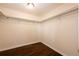 Walk-in closet with hardwood floors and shelving/hanging storage at 73 N Dutch Valley Rd, Bennett, CO 80102