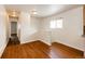 Cozy dining room featuring beautiful hardwood floors and natural light from the window at 73 N Dutch Valley Rd, Bennett, CO 80102