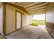 Back porch with stone accents providing access to a large backyard at 73 N Dutch Valley Rd, Bennett, CO 80102