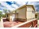 Exterior view of home featuring a back deck and stone accents at 73 N Dutch Valley Rd, Bennett, CO 80102