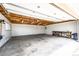 Spacious garage featuring high ceilings, work bench, and window at 73 N Dutch Valley Rd, Bennett, CO 80102